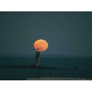  A Lighthouses Silhouette against a Full Moon Photographic 