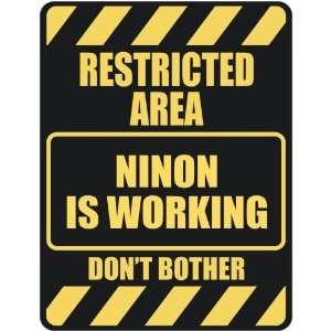     RESTRICTED AREA NINON IS WORKING  PARKING SIGN