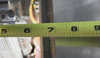 The overall diameter of the round plate door on the right end of the 