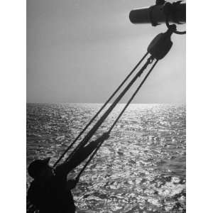  Man Checking the Rigging of a Large Sailing Ship 