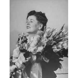  An Unidentified Woman Holding Flowers after a Concert 