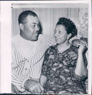   Louis, wife. Heavyweight champion boxer Joe Louis is shown on the