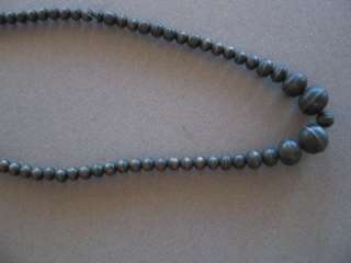 An old out of pawn Navajo silver bead necklace. It measures 23 inches 