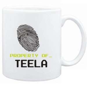  Mug White  Property of _ Teela   Fingerprint  Female 
