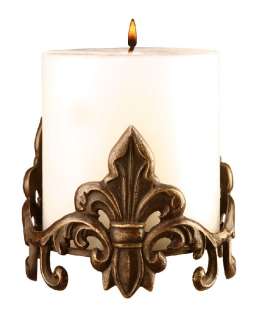 This beautiful pillar candle holder is made of bronze and has a 