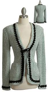 Inviting sequin trimmed knit cardigan has front patch pockets and 