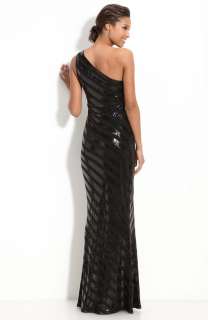   one shoulder jersey gown, visually enhancing the fluid silhouette