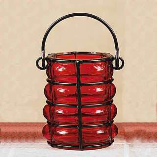 This red glass hanginglantern holds a votive candle. Works well around 