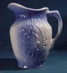 BEADED ROSE SPEAR POINT BLUE & WHITE STONEWARE PITCHER  
