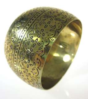 You are bidding on a DESIGNER Gold Tone Floral Engraved Bangle 