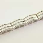  tennis bracelet features 18 dome shaped links filled with channel 
