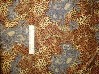  100 percent cotton fabric has brown, black and cream leopard spots 
