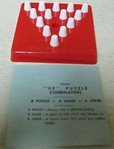 COLLECTIBLE RED & WHITE SMALL KE PUZZLE GAME  