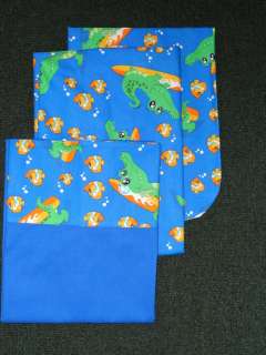 The theme for this crib sheet set   Surfing gator and fish friends