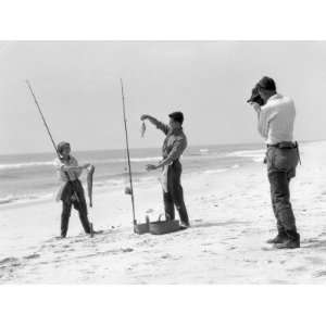  Woman and Two Men All Are Wearing Surf Fishing Gear 