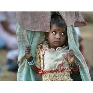  A Displaced Tamil Child Hangs to Her Fathers Sarong 