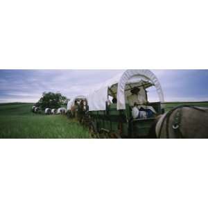 Historical Reenactment of Covered Wagons in a Field, North Dakota, USA 